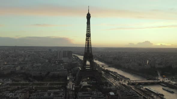 AERIAL: Drone Slowly Circling Eiffel Tower, Tour Eiffel in Paris, France with View on Seine River in