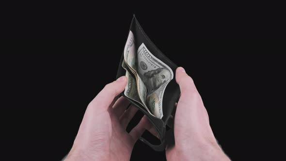 Male Hands Show a Black Wallet with Some Dollar Bills on Alpha Channel