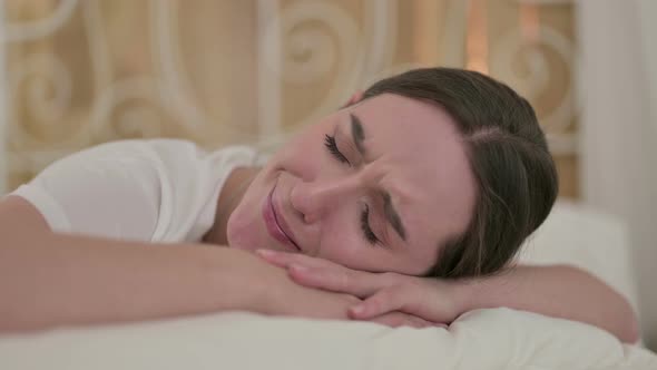 Close Up of Upset Young Woman Crying in Bed 