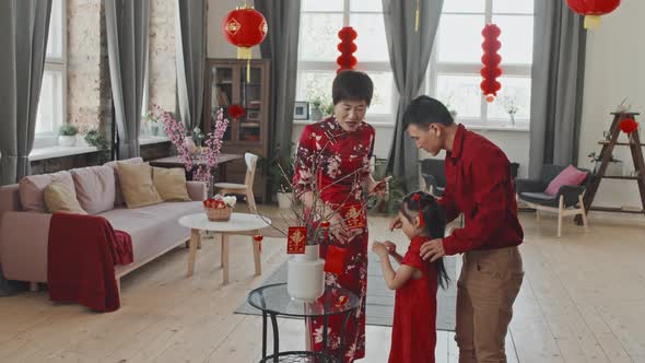 Asian Family Decorating for Chinese New Year