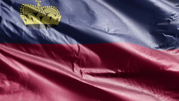 Liechtenstein textile flag waving on the wind. Slow motion. 20 seconds loop.