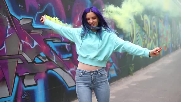 Girl Dancing with Yellow Smoke Canister