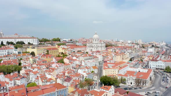Aerial Wide Dolly in View of Colorful Traditional Old Houses and Church of Santa Engracia on the