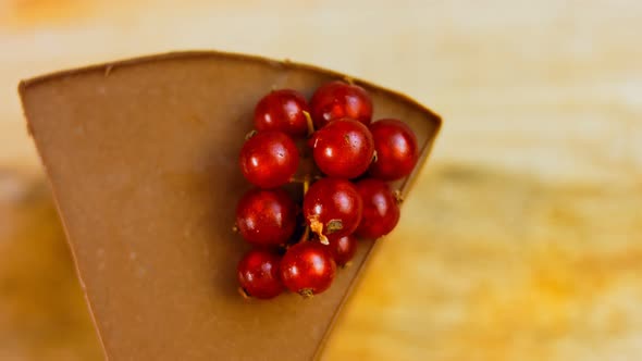 A Slice of Strawberry and Jelly Cake with a Sprig of Currant