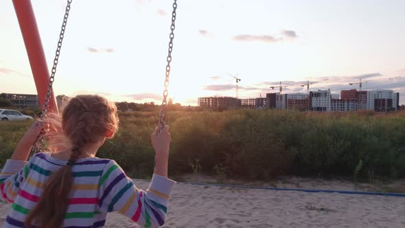 Girl On Swing Sunset