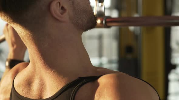 Muscleman Working out By Doing Pull-Down Exercise in Gym, Strong Masculine Body