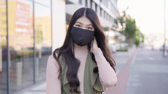 Young Asian Woman Face Mask Looks Camera Street Urban Area