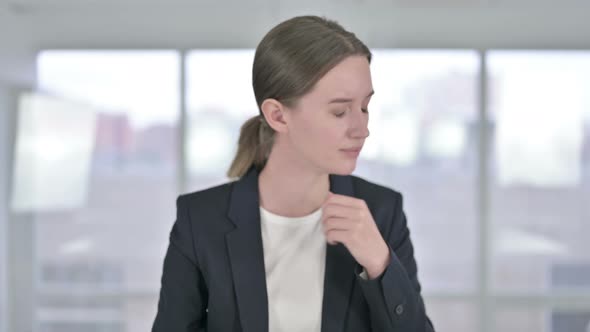 Portrait of Sick Young Businesswoman Coughing