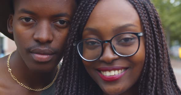 Close Up Romantic Portrait of Happy Hipster Afro Couple in Love Smiling at Camera