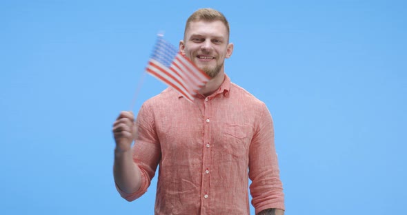 Young Man Waving US Flag