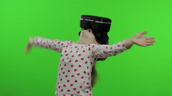 Child Girl Using VR Headset Helmet To Play Game, Watching Virtual Reality 3d 360 Video, Chroma Key