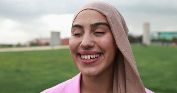 Young arabian girl smiling on camera outdoor