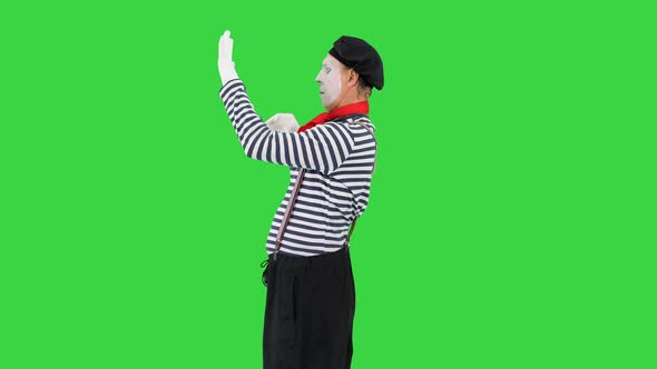 Mime Walking in Facing the Wall Opening the Door and Walking Away on a Green Screen Chroma Key