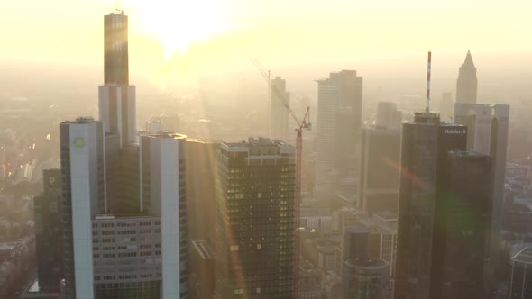 AERIAL: View of Frankfurt Am Main, Germany Skyline with Sunflair Between Skyscrapers in Beautiful