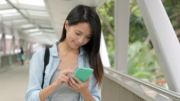 Woman use of mobile phone at outdoor