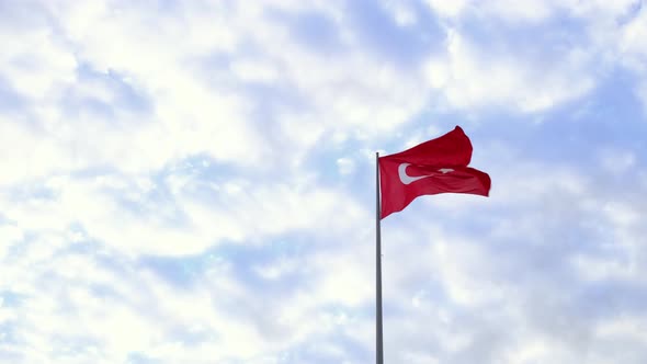 Turkish Flag Waving in Blue Sky