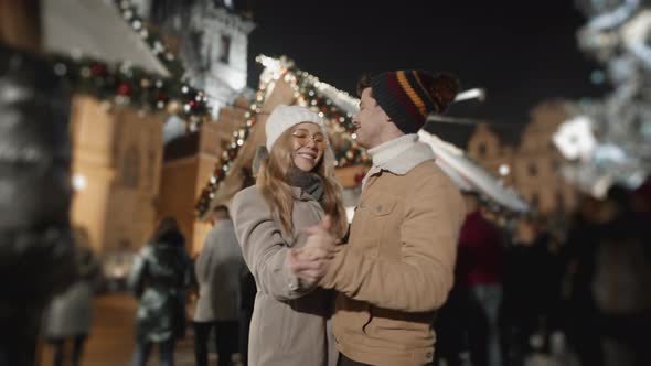 Happy Couple Dancing at Night Square in Prague