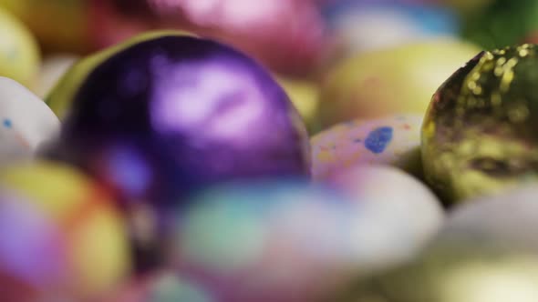 Rotating shot of colorful Easter candies on a bed of easter grass - EASTER 196