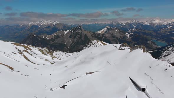 Aerial Drone View on Snowy Peaks of Swiss Alps. Switzerland. Rochers-de-Naye Mountain Peak.