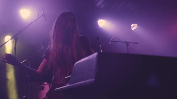 Beautiful Young Woman DJ Play the Music on the Mixing Console in the Nightclub