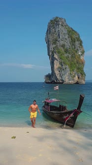 Men on Tropical Koh Poda Beach in Krabi Thailand White Tropical Beach of Koh Poda Thailand