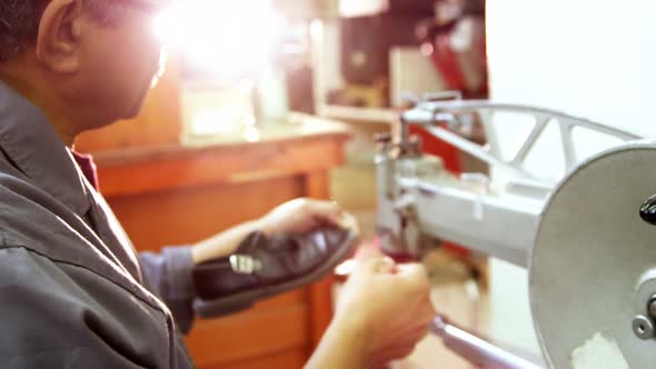 Shoemaker using sewing machine