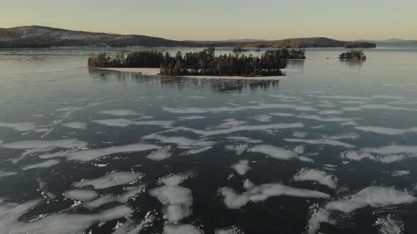 Islands on frozen Moosehead Lake. Maine. USA. Bird's eye drone view