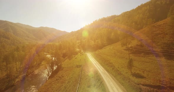 Low Altitude Flight Over Fresh Fast Mountain River with Rocks at Sunny Summer Morning.