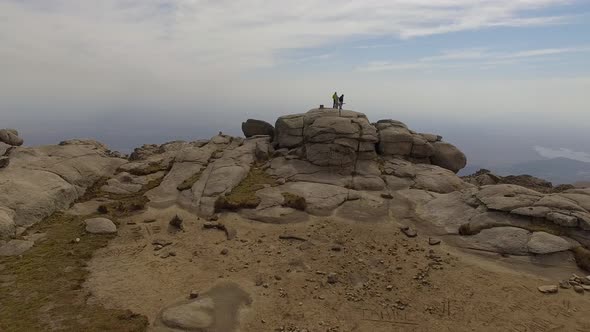 Hikers looking at view on Mount Champaqui, Cordoba Province, Argentina