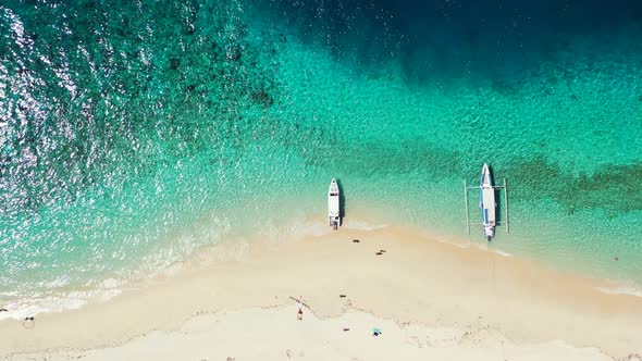 Daytime overhead copy space shot of a paradise sunny white sand beach and blue sea background in hi 