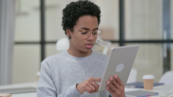 Portrait of Young African Woman Using Digital Tablet