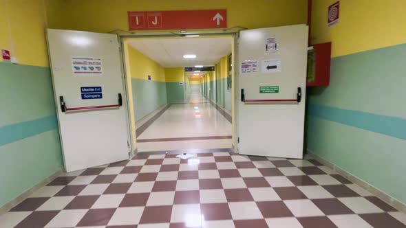 Walikng Along an Empty Corridor Inside the Hospital