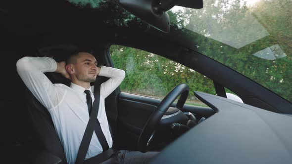 Businessman in Autonomous Car Self Driving Vehicle Autopilot