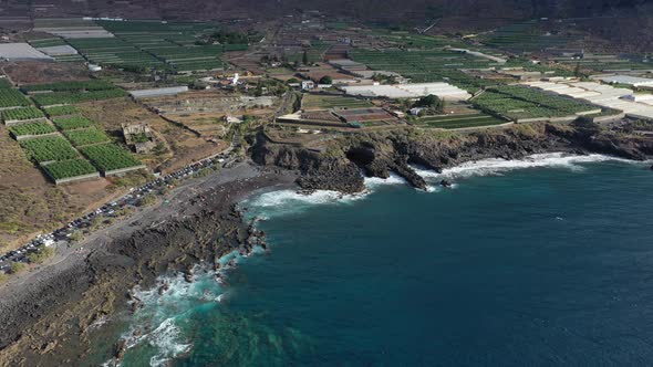 Tenerife, a view of banana plantations, a black beach of volcanic sand on the Atlantic ocean