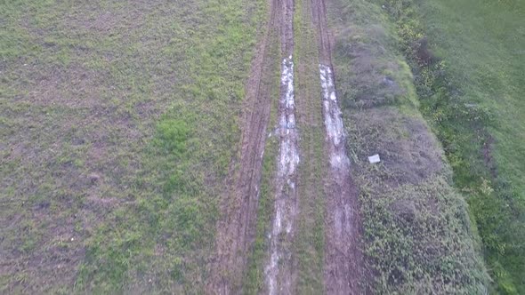 Aerial Muddy Road in Field