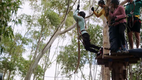 Woman swinging on a rope