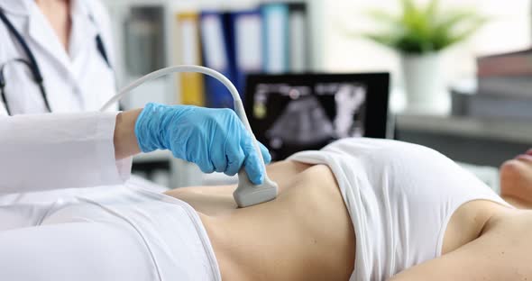Woman on Ultrasound Diagnosis of Intestines and Uterus