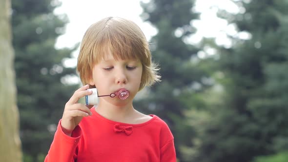 Girl with Soap Bubbles. Slow Motion. Close Up