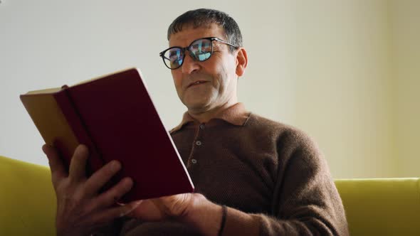 Old Man Asian Professor Historian Reading Old Book at Home