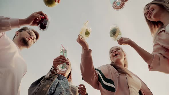 Cheerful Company of Friends Cheerfully Clink Glasses