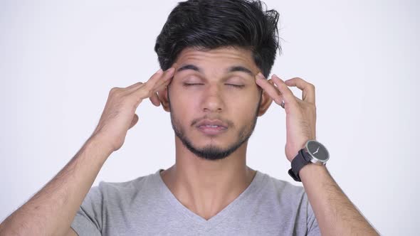 Young Stressed Bearded Indian Man Having Headache