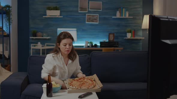 Person Bringing Box of Pizza From Delivery Man on Table