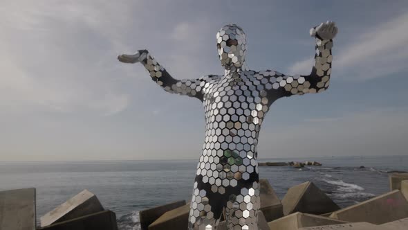 Sparkling Discosuit Man Dancing Next to the Sea