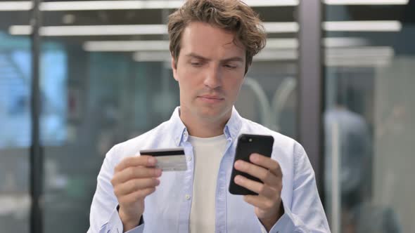 Portrait of Man Having Online Payment Failure on Smartphone