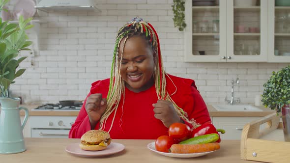 Overweight Woman Choosing Between Healthy and Junk Food