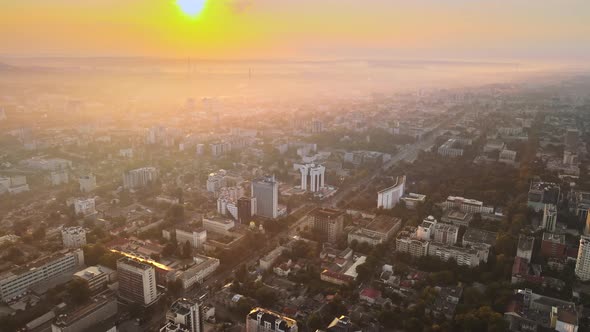Aerial drone view of Chisinau at sunrise. Panorama view of multiple buildings, roads. Moldova