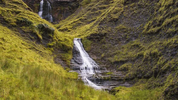 Time Lapse of local waterfall in rural grass hill area of Gleniff Horshoe in county Sligo in Ireland alt