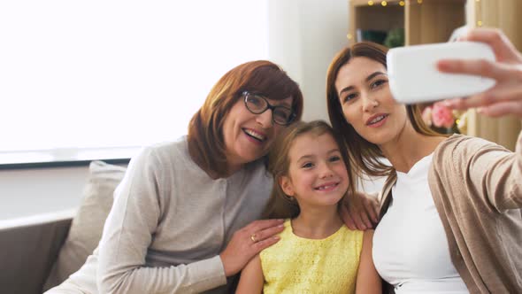 Mother, Daughter and Grandmother Taking Selfie