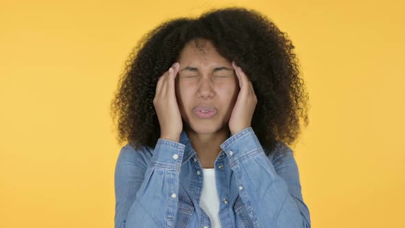 African Woman Having Headache Yellow Background