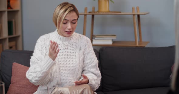 Crop View of Emotional Blond Hair Woman Talking with Her Therapist and Gesturing in Office